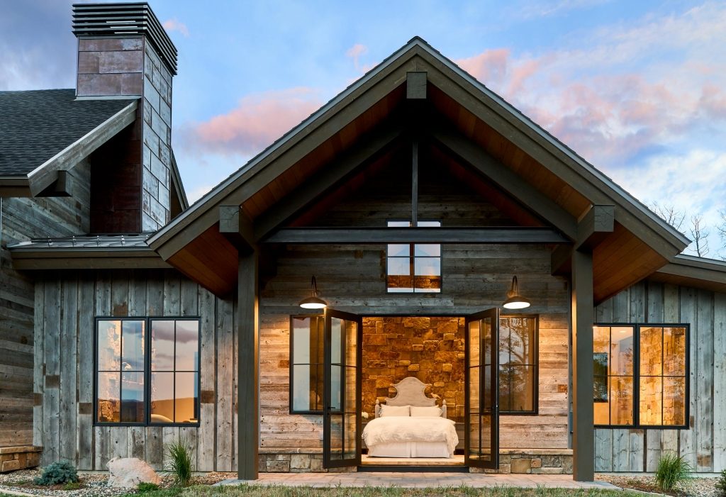 Reclaimed-wood home with heavy timber entry gable